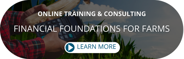 holding corn and calculator, Financial Foundations for Farms Learn More